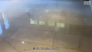 Polished marble floor in a Surrey home with a clear reflective finish