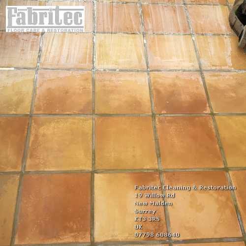 Scrubbing terracotta floors in East Horsley by Tile Cleaning Surrey